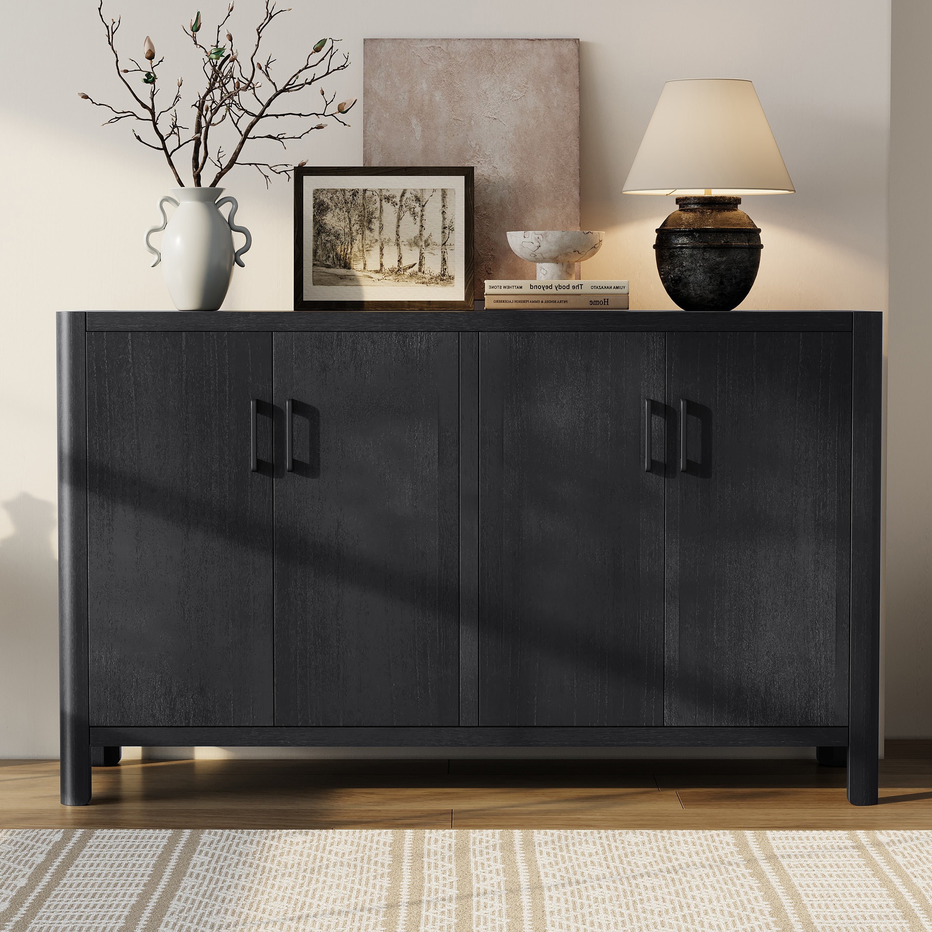 Black wooden 4-door buffet with a rustic finish, featuring clean lines and modern handles, styled with home decor.