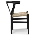 Side view of matte black beech wood dining chair with curved ergonomic backrest and handwoven natural fiber seat.