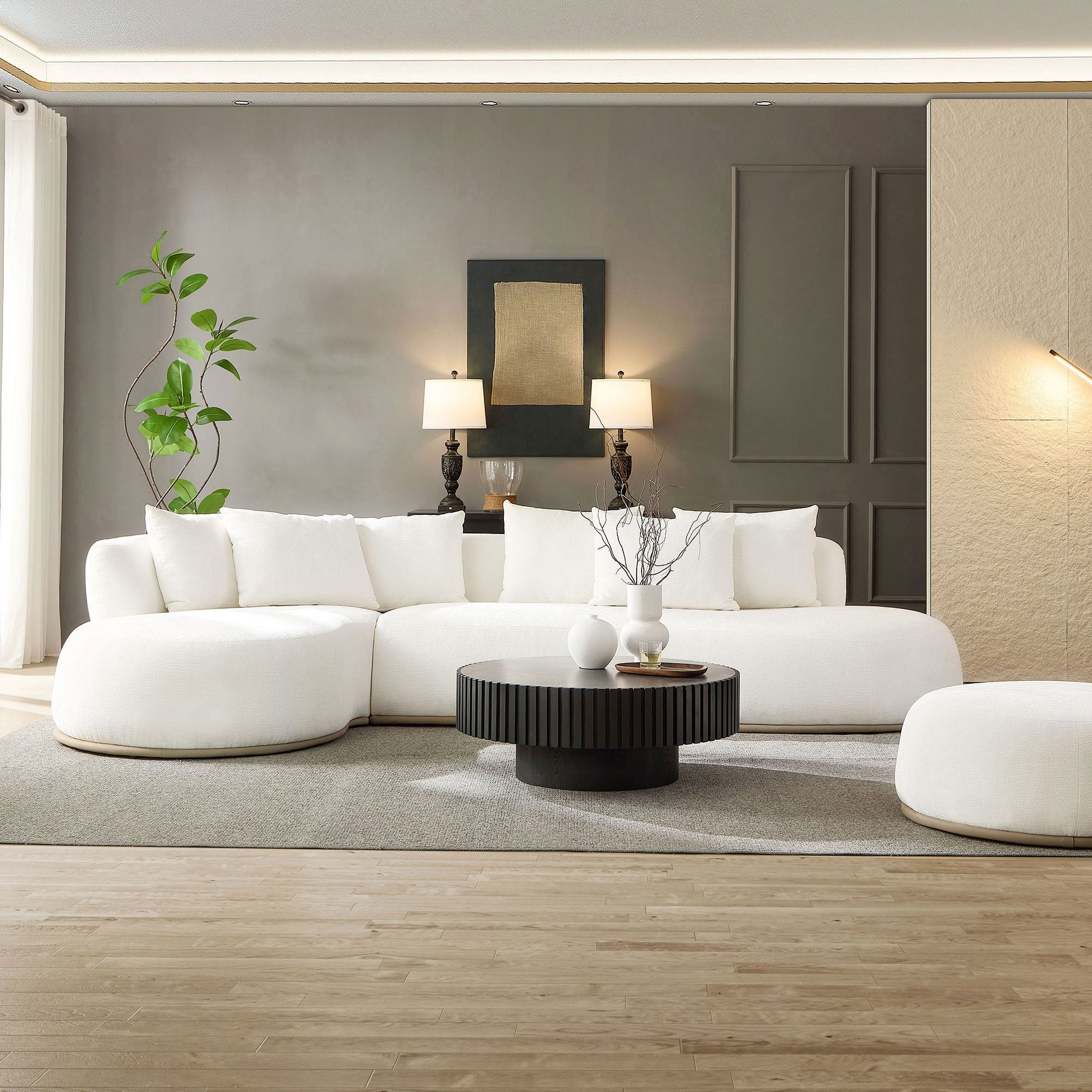 Oversized L-Shape Sectional Sofa with Chaise in Beige set against a gray accent wall, styled with lamps, wall art, and a round coffee table.