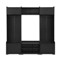 Modern black wooden hall tree with eight shoe cubbies, coat hooks, and enclosed storage cabinets for an entryway.