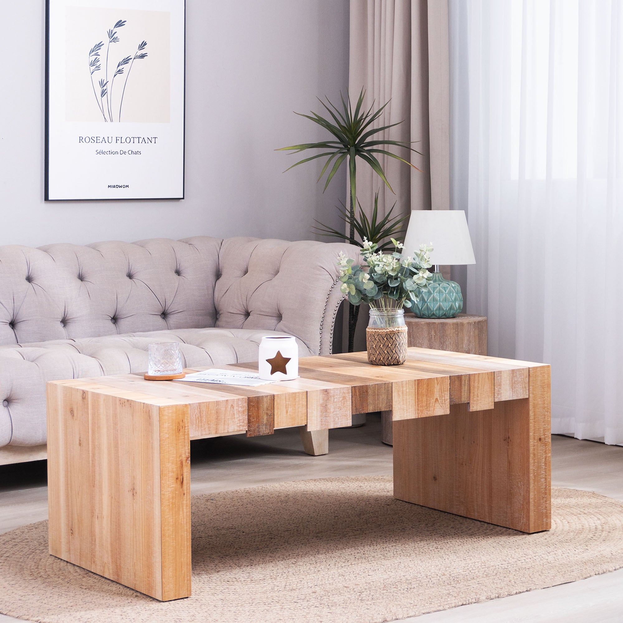 Modern Rustic Coffee Table styled in a cozy living room, showcasing its natural wood finish and spacious surface for decor.