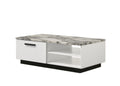 White Marble Top Coffee Table-Matilda 47' with faux marble surface, black base, side drawer, and open shelving for modern storage.