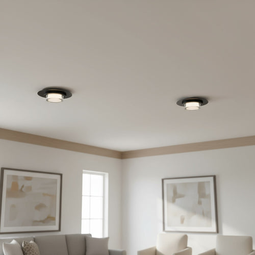 12" Square LED Flush Mount Light in black installed in a modern living room. Sleek ceiling fixture offers 3 color temperatures and 750 lumens.