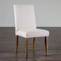 Rustic dining chair with white upholstered seat and backrest, featuring solid wood legs in a brown finish, ideal for cozy dining spaces.
