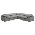 Grey 5-piece modular sectional in plush bouclé fabric, featuring deep seats, reclined back pillows, and low profile.