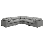 Grey 5-piece modular sectional in plush bouclé fabric, featuring deep seats, reclined back pillows, and low profile.