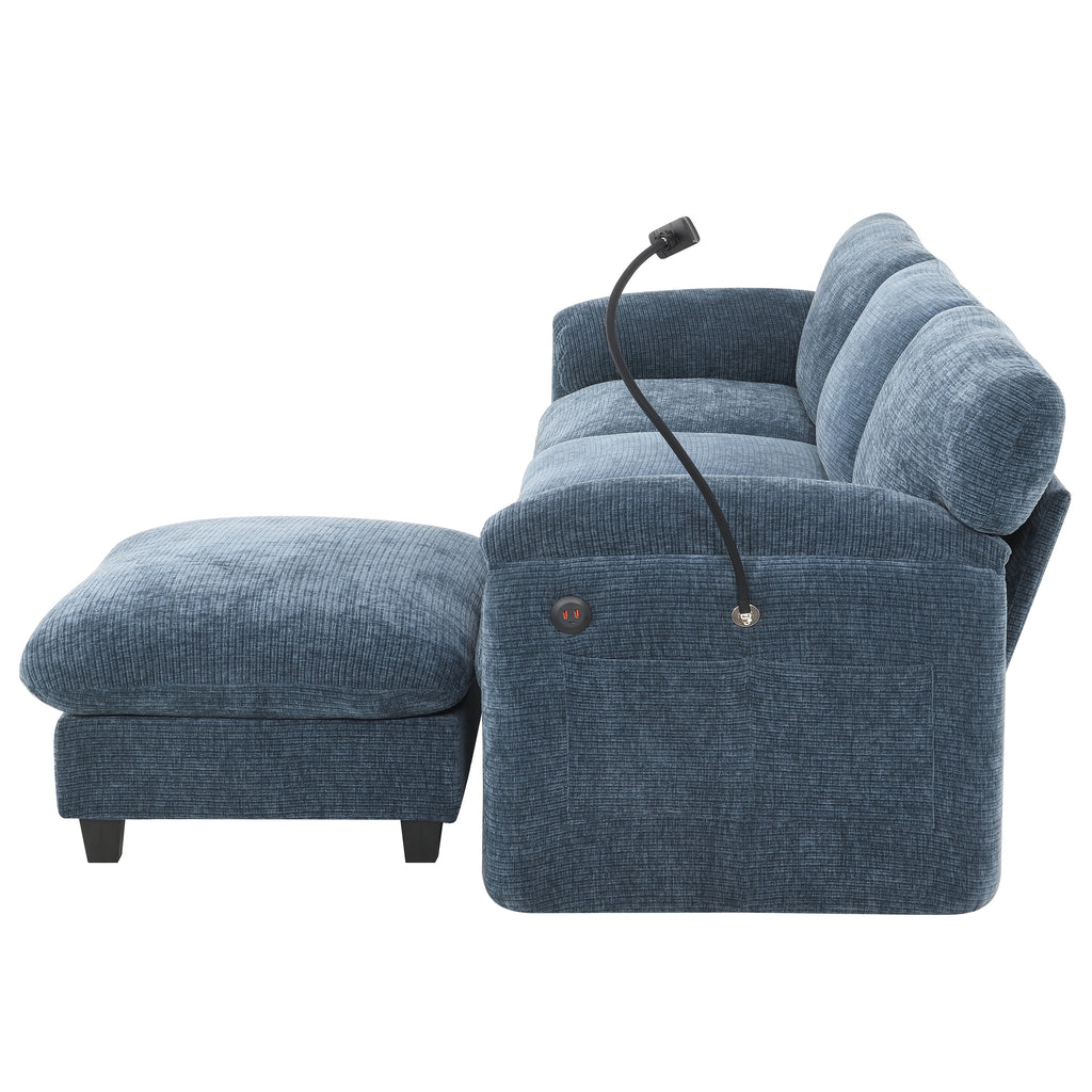 Side view of modular sofa with built-in USB charger and flexible reading light. Blue upholstered sectional with plush cushions and storage pocket.