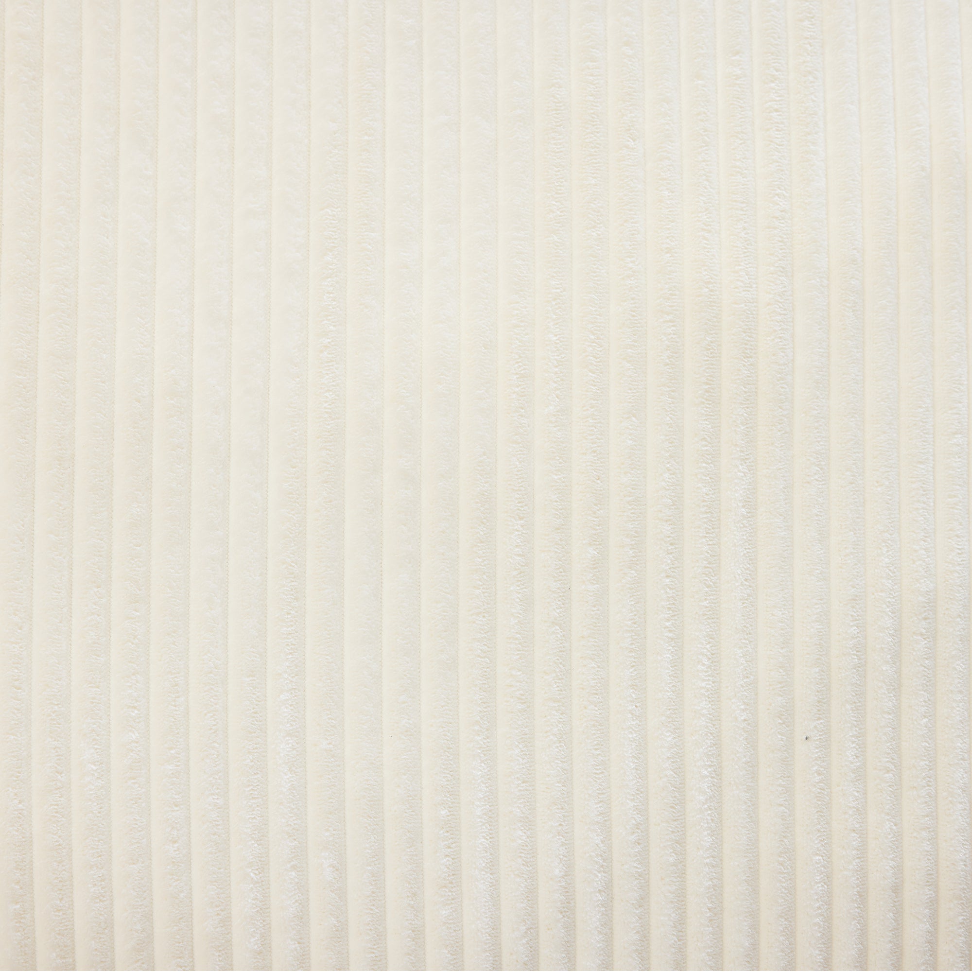 Detailed texture of white corduroy fabric used in the Compressed Corduroy Sofa, highlighting soft and skin-friendly material.