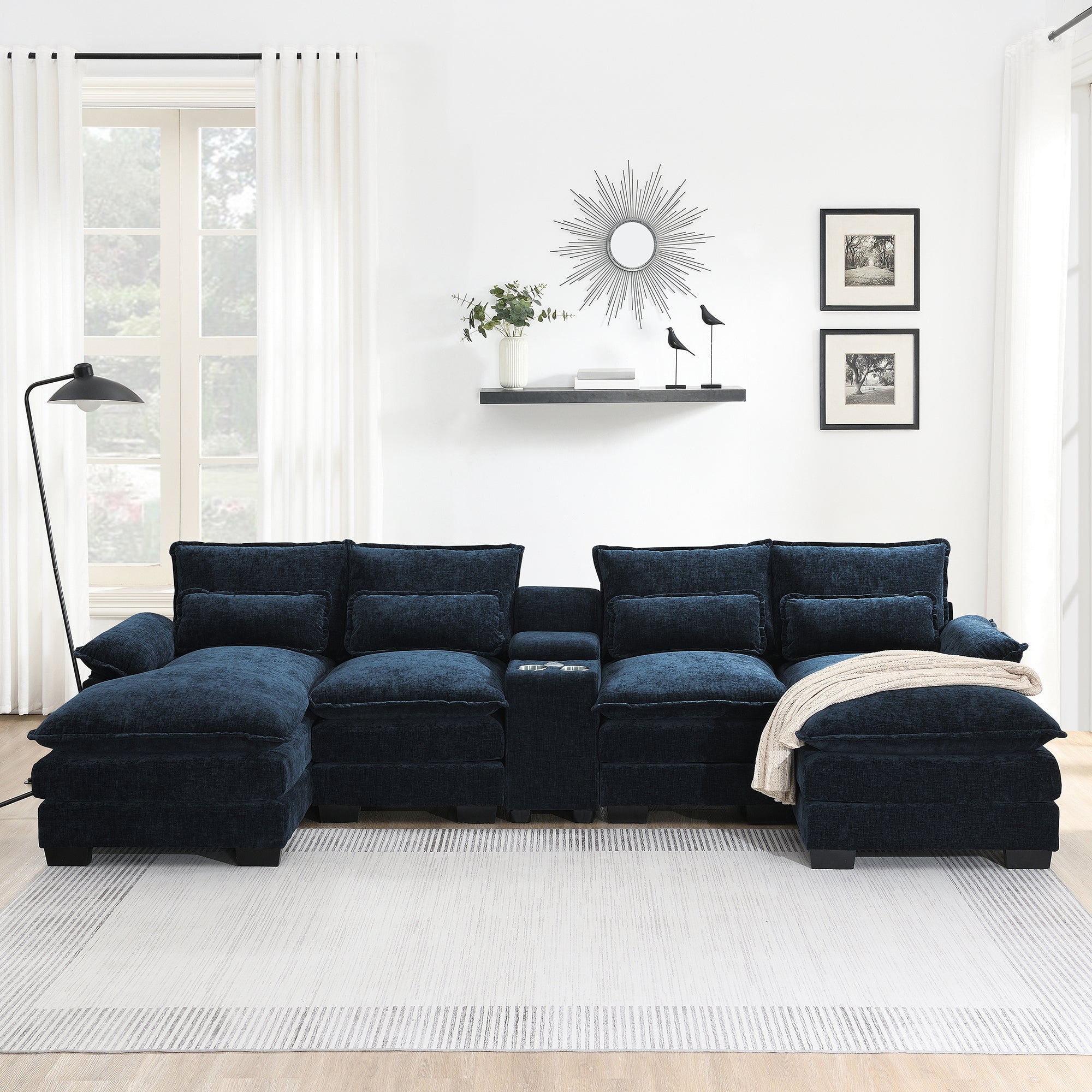 Front view of U-shaped sectional sofa with USB charger and console, upholstered in soft navy chenille with cozy cushions and cup holders.