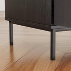 Close-up of Eco-Friendly Record Player Stand’s sturdy black metal legs and wood texture, highlighting durable construction and modern style.