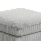 Close-up of Bentley Modular Sectional Sofa ottoman cushion in gray corduroy, highlighting soft ribbed fabric and thick padding.