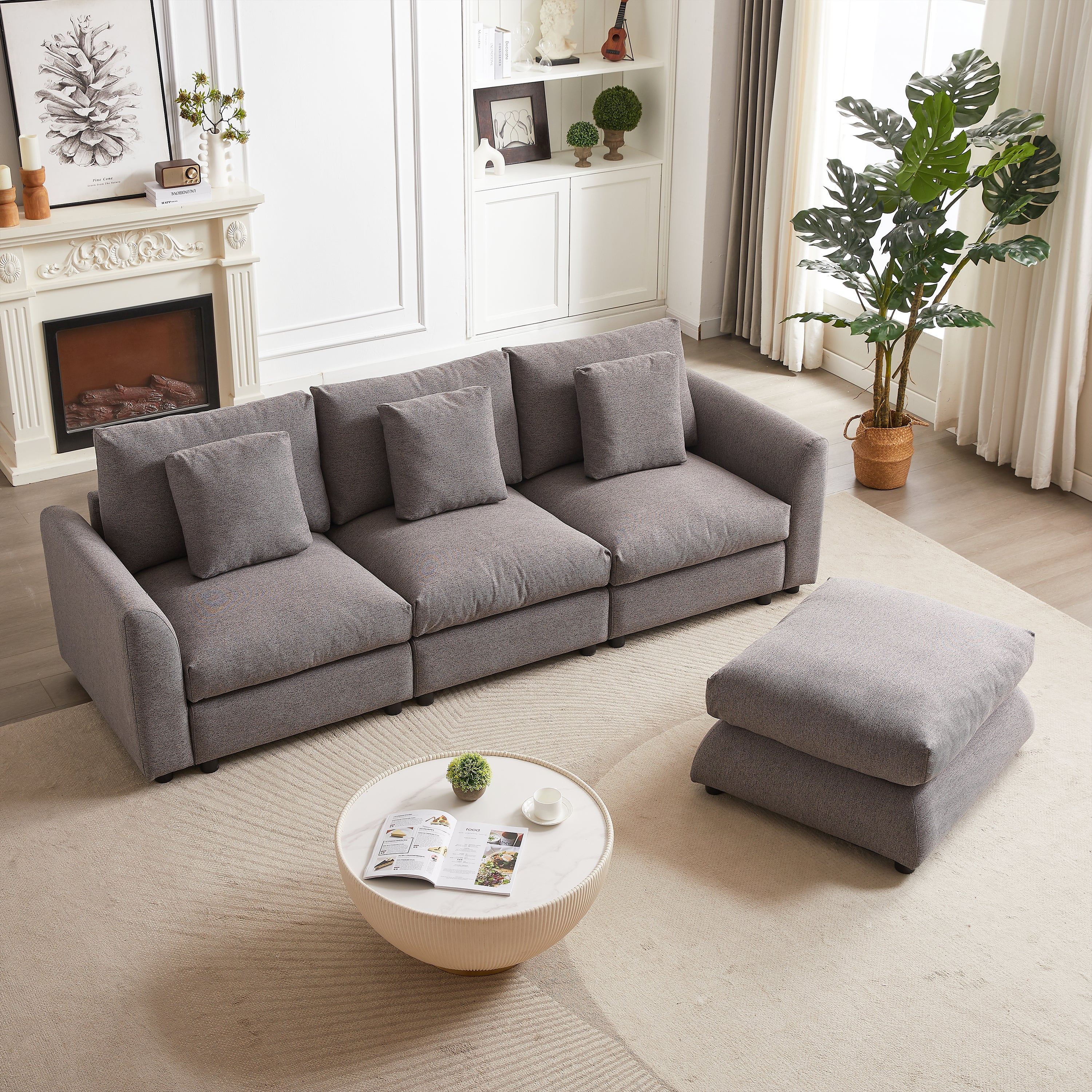 Gray modular sofa with ottoman separated and placed in a straight line, showcasing versatile configuration in a cozy living space.