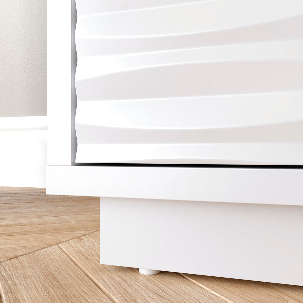 Detail of the base and textured drawer front of the White Coastal Credenza, highlighting its modern design and clean lines.