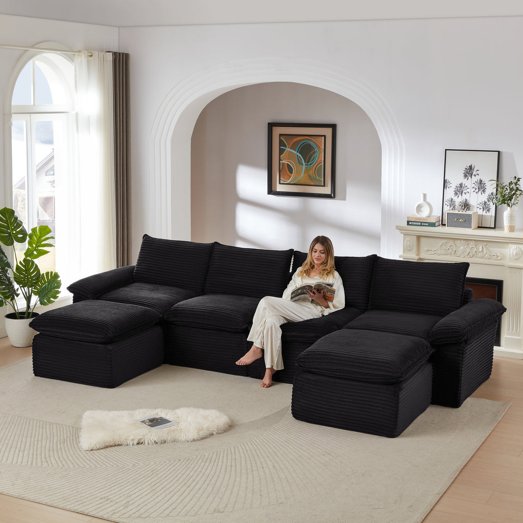 Corduroy Cloud Sofa - Modern Living Room Furniture in black, featuring a woman reading on the spacious sectional in a cozy, stylish setting.