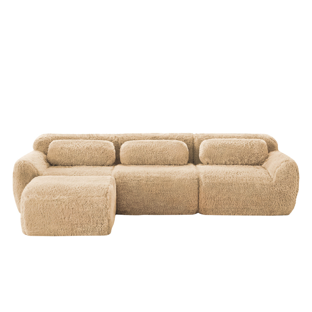 Front view of plush fabric modular sectional sofa with ottoman. Soft, cozy seating ideal for modern living rooms.