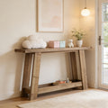 Narrow rustic wooden console table with a two-tier design, styled in a cozy entryway with decor accents.