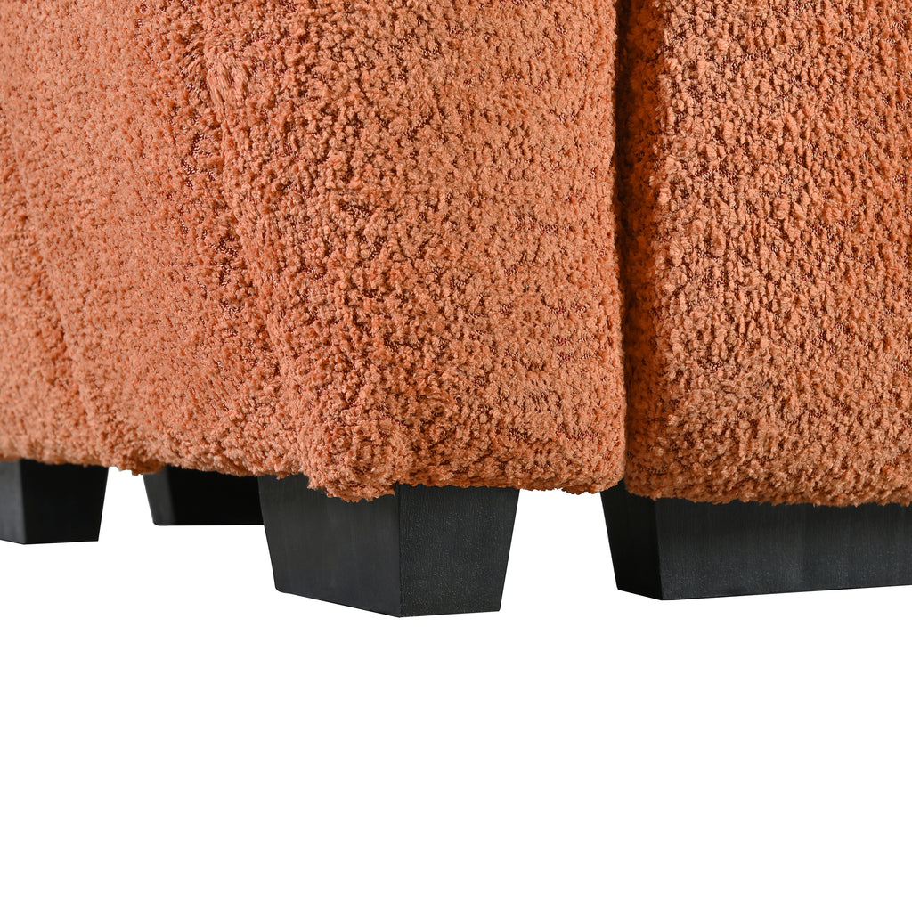 Close-up of boucle fabric texture and black plastic legs on the modular sectional sofa with ottoman, emphasizing durability and style.