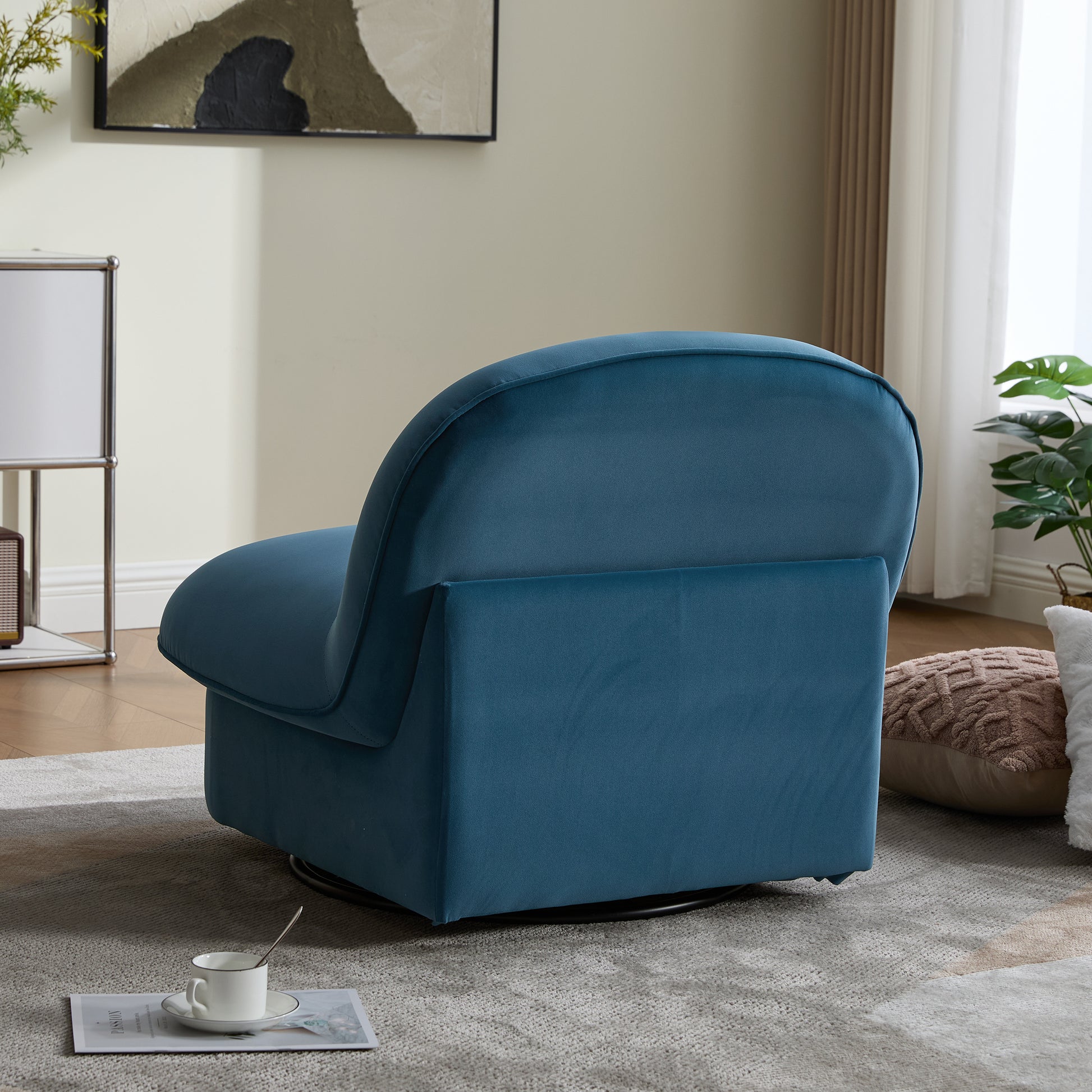 Back angle of teal velvet swivel accent chair with smooth upholstery and sturdy base, perfect for cozy seating areas.