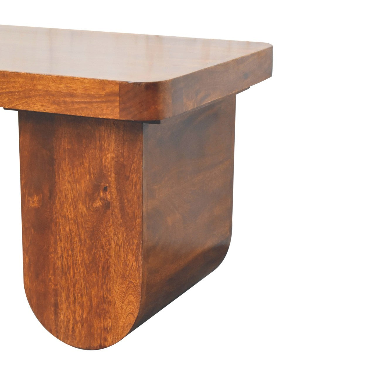 Close-up of chunky mango wood coffee table leg with smooth chestnut finish and rounded edge design.