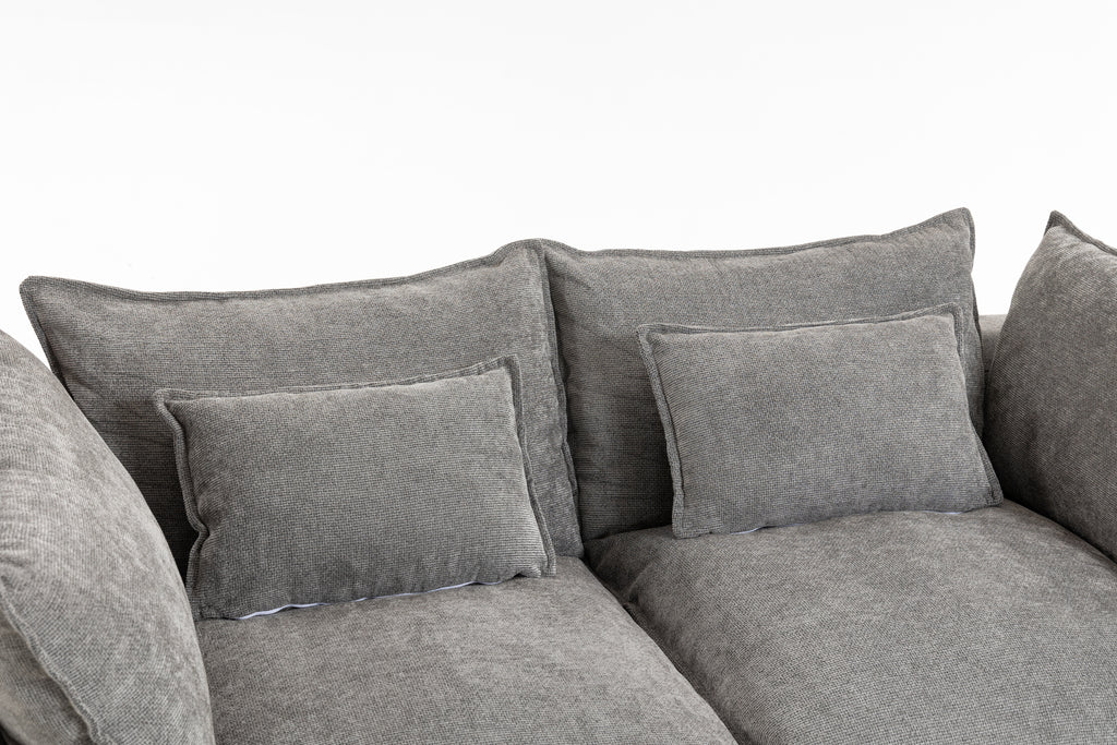 Top view of the Cloud Couch showing two large seat cushions and four plush back pillows in soft grey velvet.