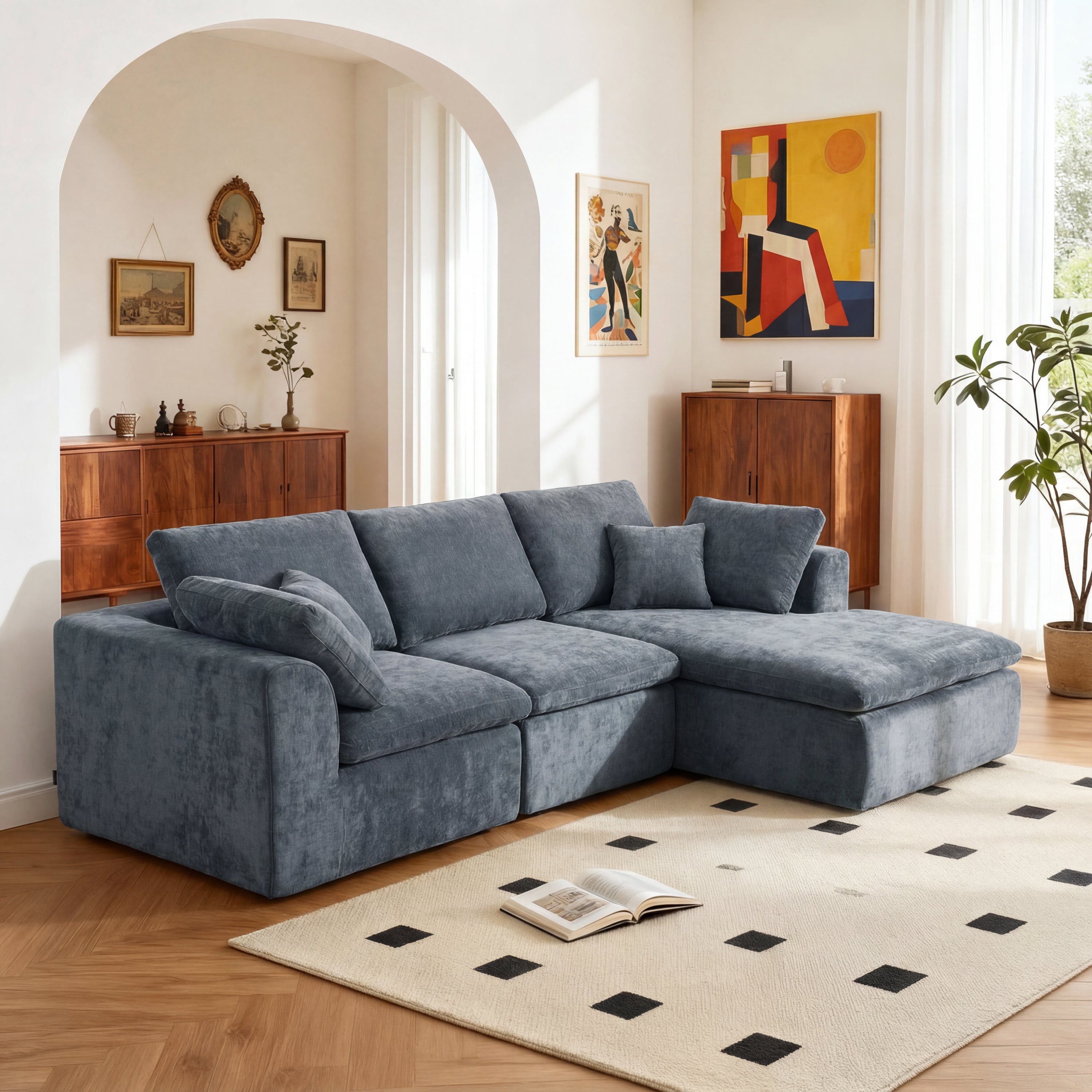 L-Shaped Sectional Sofa - Modern Reversible Chaise Couch in blue chenille fabric, placed in a cozy living room with wood accents and wall art.