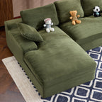 Close-up of green corduroy sofa chaise section with soft pillow. Foam-filled and textured for maximum comfort.