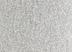 Close-up texture of the gray boucle fabric used in the upholstered accent chair, emphasizing its soft and durable material.