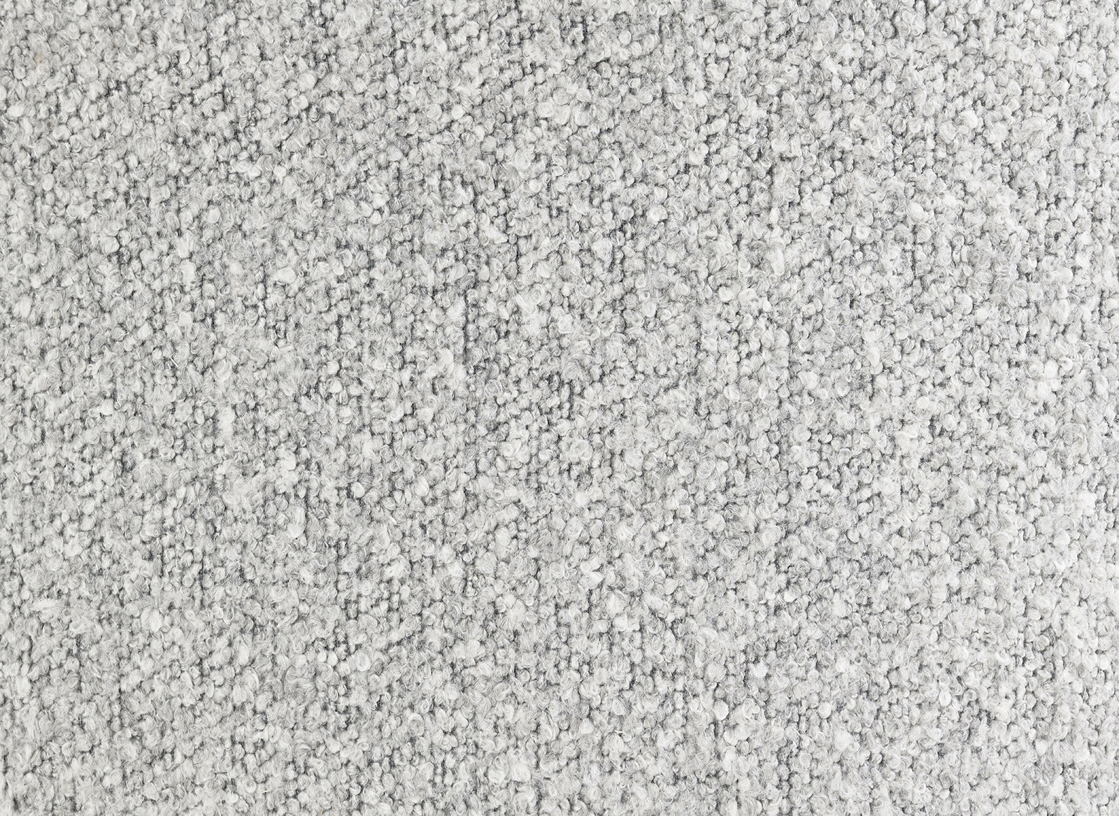 Close-up texture of the gray boucle fabric used in the upholstered accent chair, emphasizing its soft and durable material.
