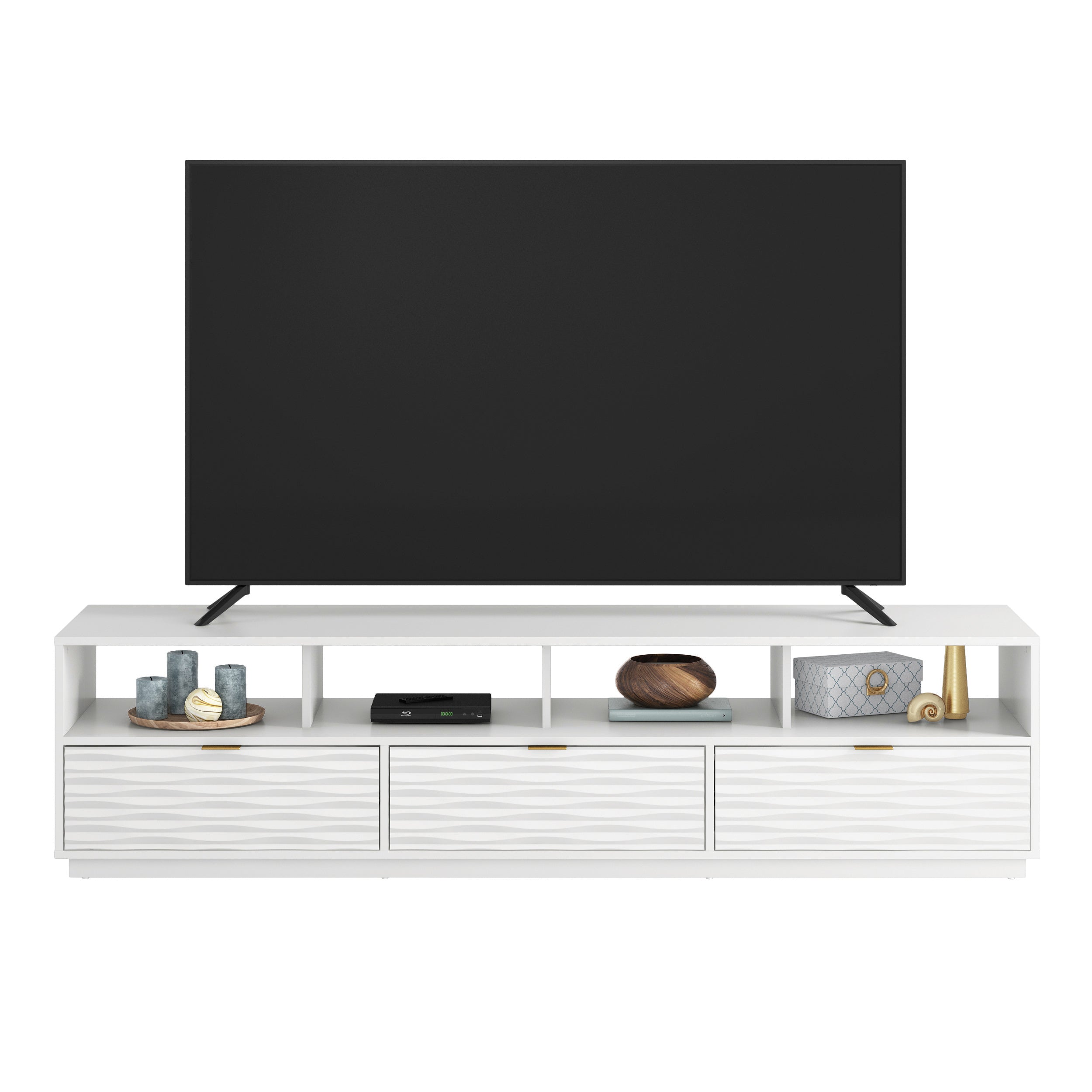 Front view of White Coastal Credenza supporting a large TV, featuring ample open shelving and three wave-textured drawers.