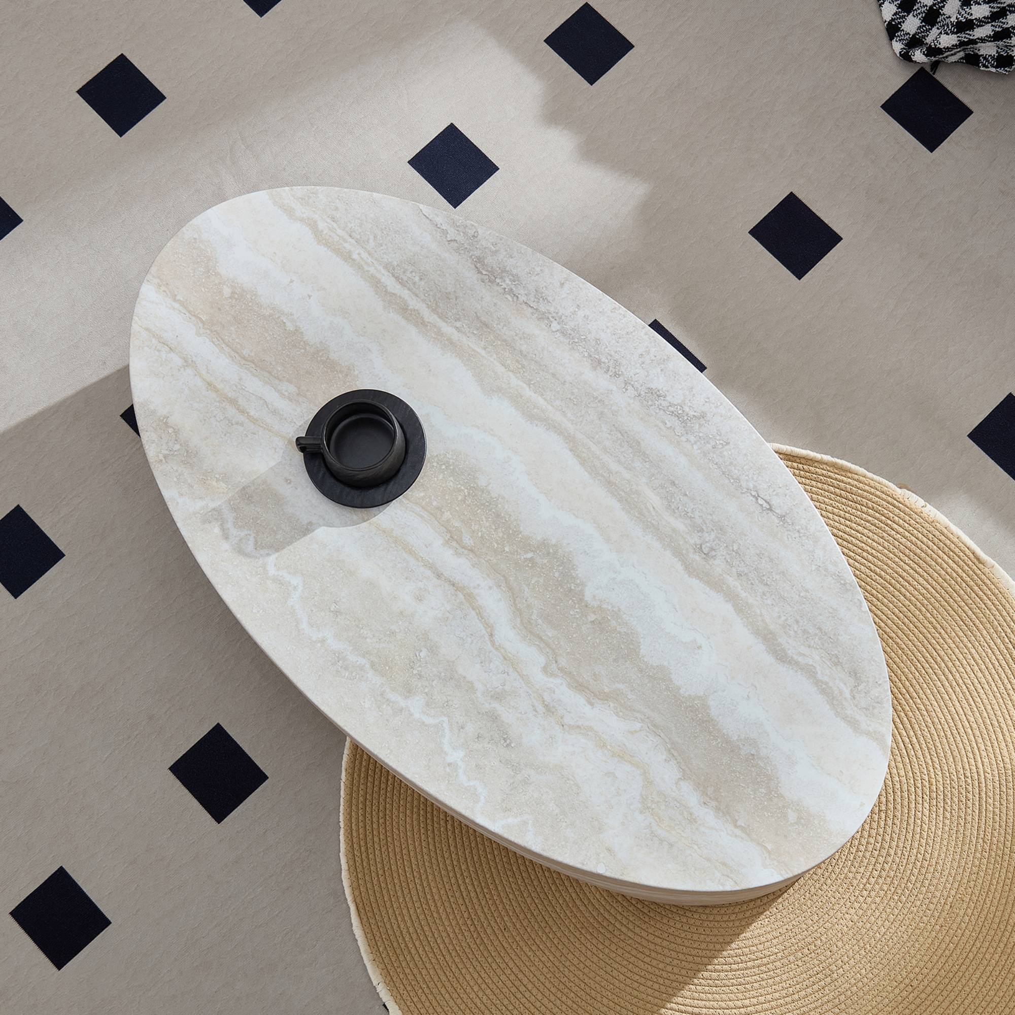 Overhead view of oval marble coffee table showcasing its natural stone texture and sleek, polished finish.