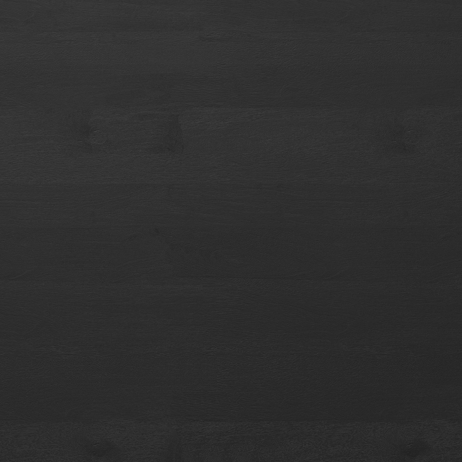 Close-up of Whitley Dining Table's black mango wood tabletop showing natural grain texture and matte finish.