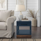 Nora 22 Inch End Table - No Assembly in two-tone Blue Denim and Whiskey finish styled in a cozy living space with books and a lamp.
