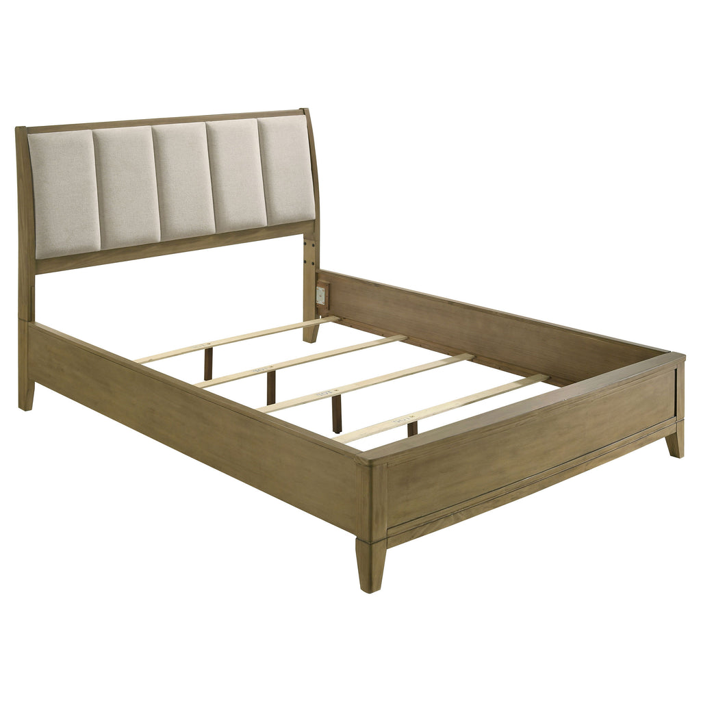 Queen panel bed in natural solid pine with a beige textured upholstered headboard and sturdy slat support system.