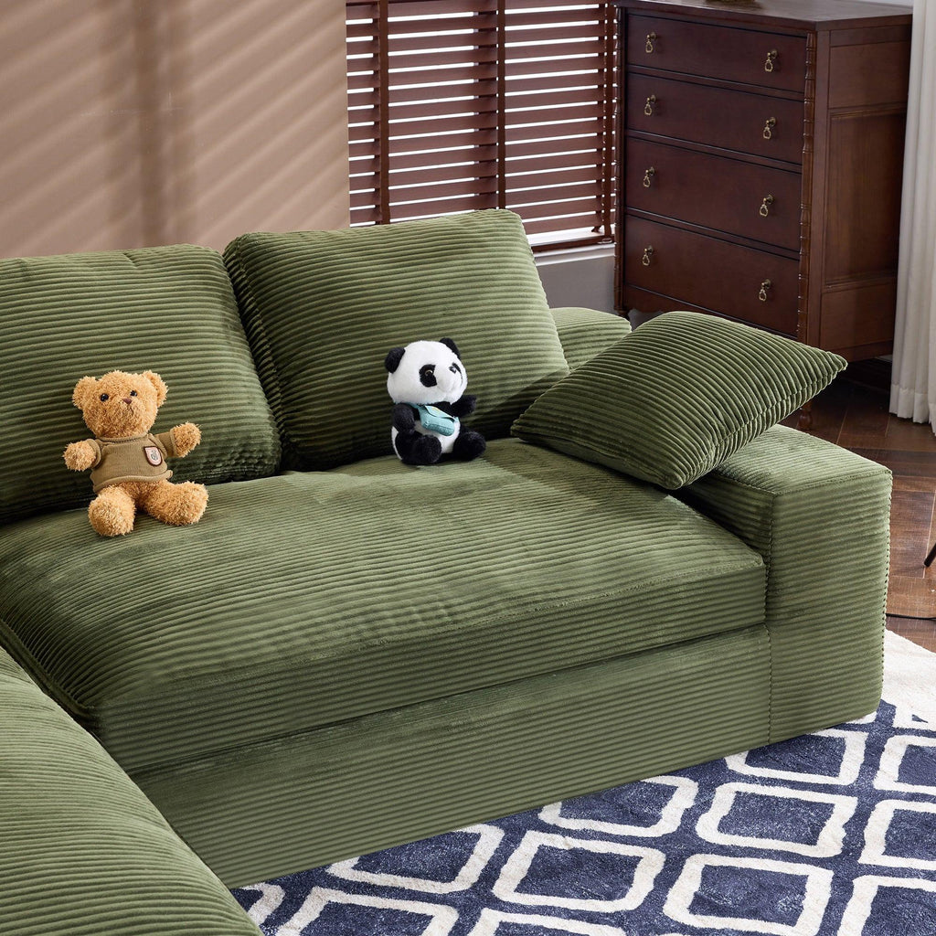 Green Corduroy Sofa with Cushions and Pillows.