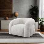 Modern living room featuring the White Swivel Chair Contemporary with sculptural form, boucle texture, and 360-degree swivel base.
