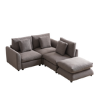 L-shaped modular sofa with ottoman, upholstered in gray fabric, featuring three seat cushions and four pillows for customizable comfort.