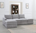 Contemporary 5-piece modular sectional in granite gray fabric, featuring plush cushions and vertical-tufted base design.