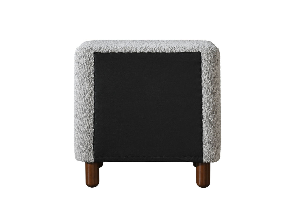 Back view of Cleo Gray Boucle Nightstand with black fabric panel and wooden legs. Stylish and functional bedroom furniture design.