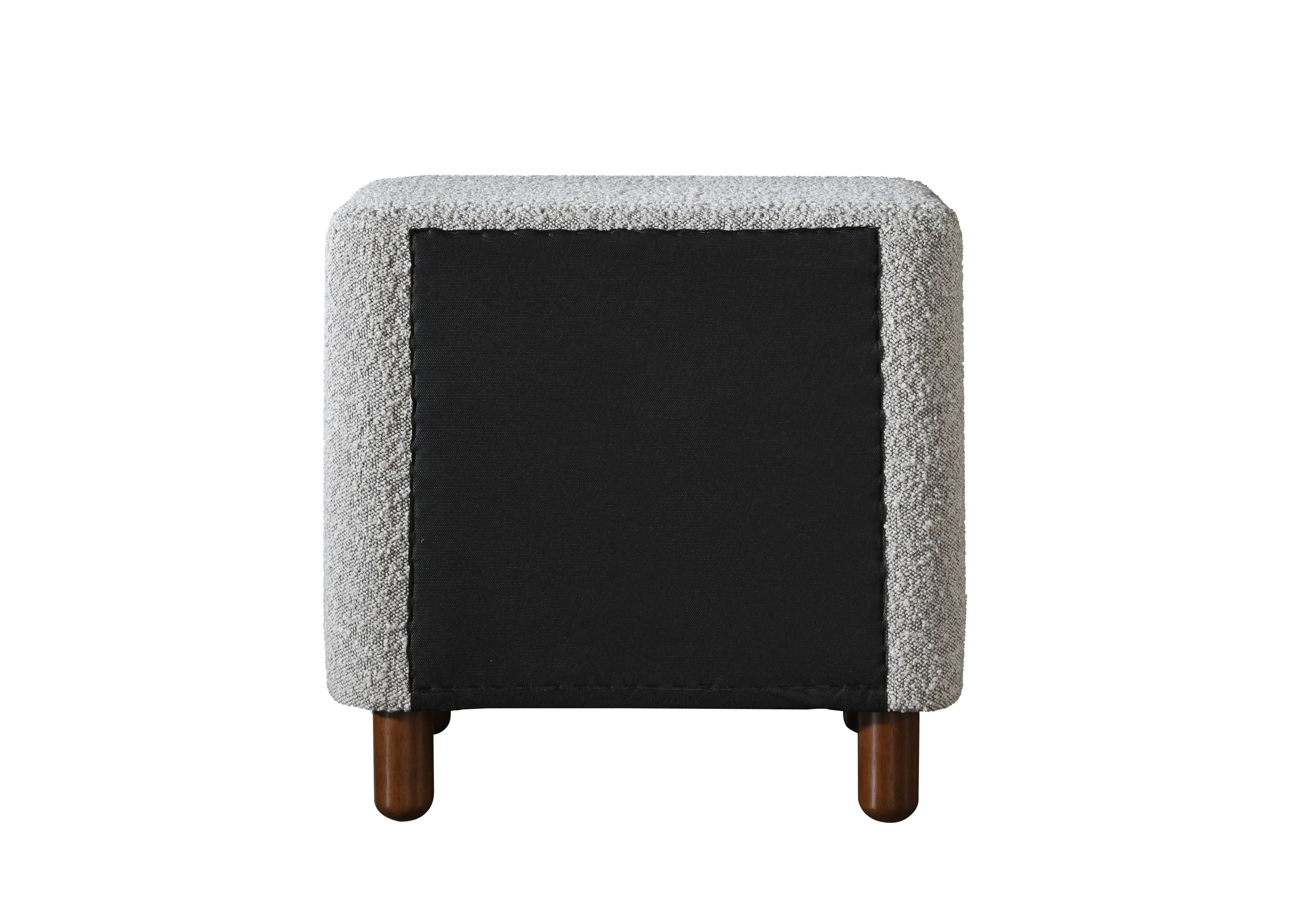 Back view of Cleo Gray Boucle Nightstand with black fabric panel and wooden legs. Stylish and functional bedroom furniture design.