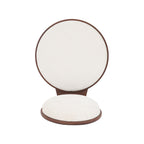 Close-up of a single beige dining chair seat and backrest detached from frame. Showcases soft fabric and circular design.