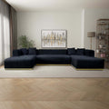 Modern U-shaped sectional sofa in black velvet with channel tufting and a sleek gold metallic base.