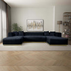 Modern U-shaped sectional sofa in black velvet with channel tufting and a sleek gold metallic base.