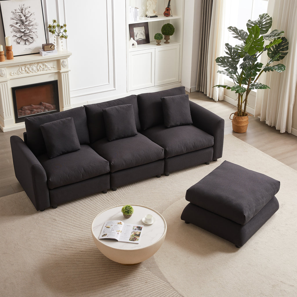 Black modular sofa with detached ottoman and 3 cushions, arranged in a straight layout for versatile living room seating.