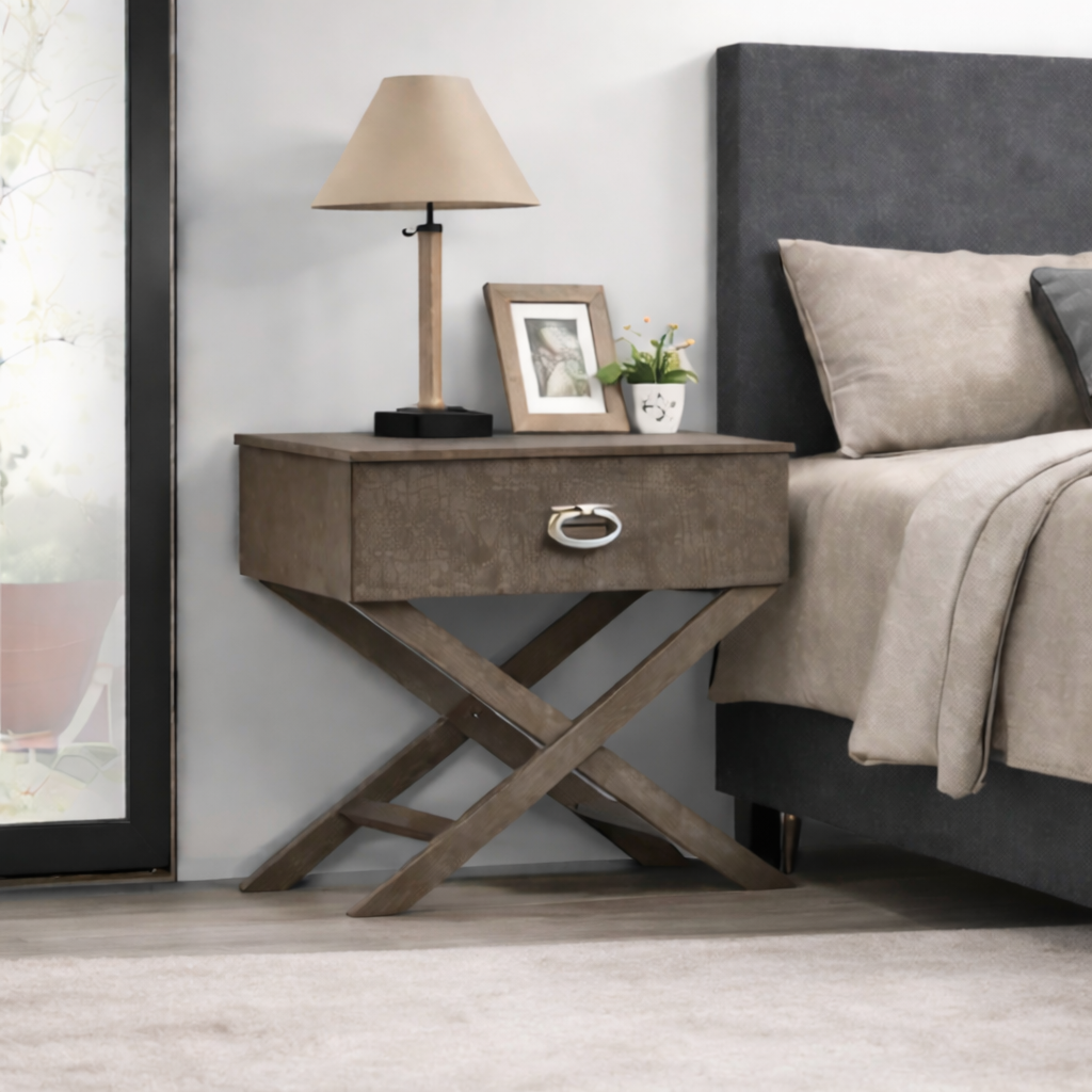Modern gray wooden nightstand featuring a single drawer with a metallic pull and a distinctive X-frame base.