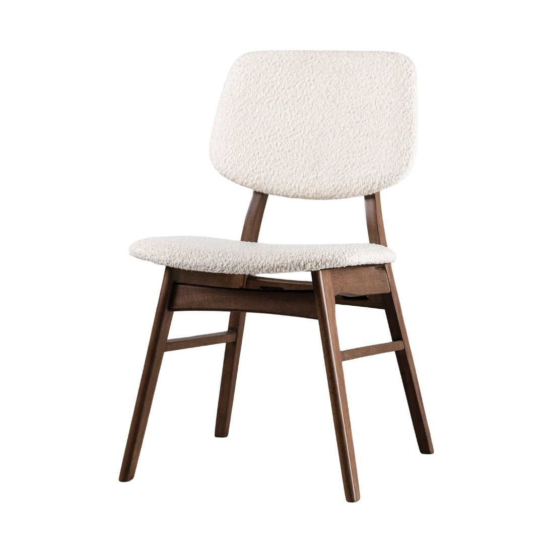 Comfortable mid-century dining chair with beige upholstery and walnut angled legs, designed for contemporary dining areas.