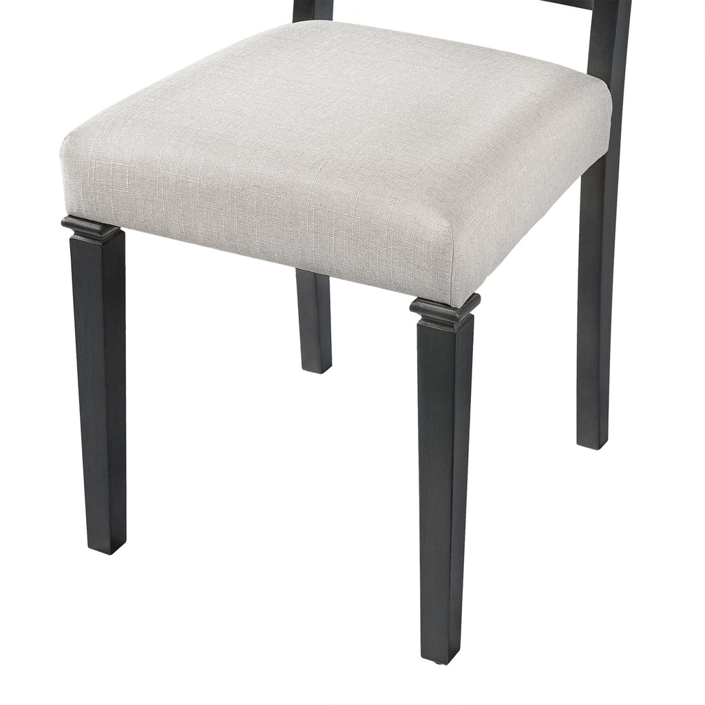 Close-up of retro dining chair seat with beige upholstery and black wooden legs, designed for comfort and durability in dining rooms.