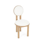 Angled view of polyester dining chair with natural wood legs and soft white upholstery.