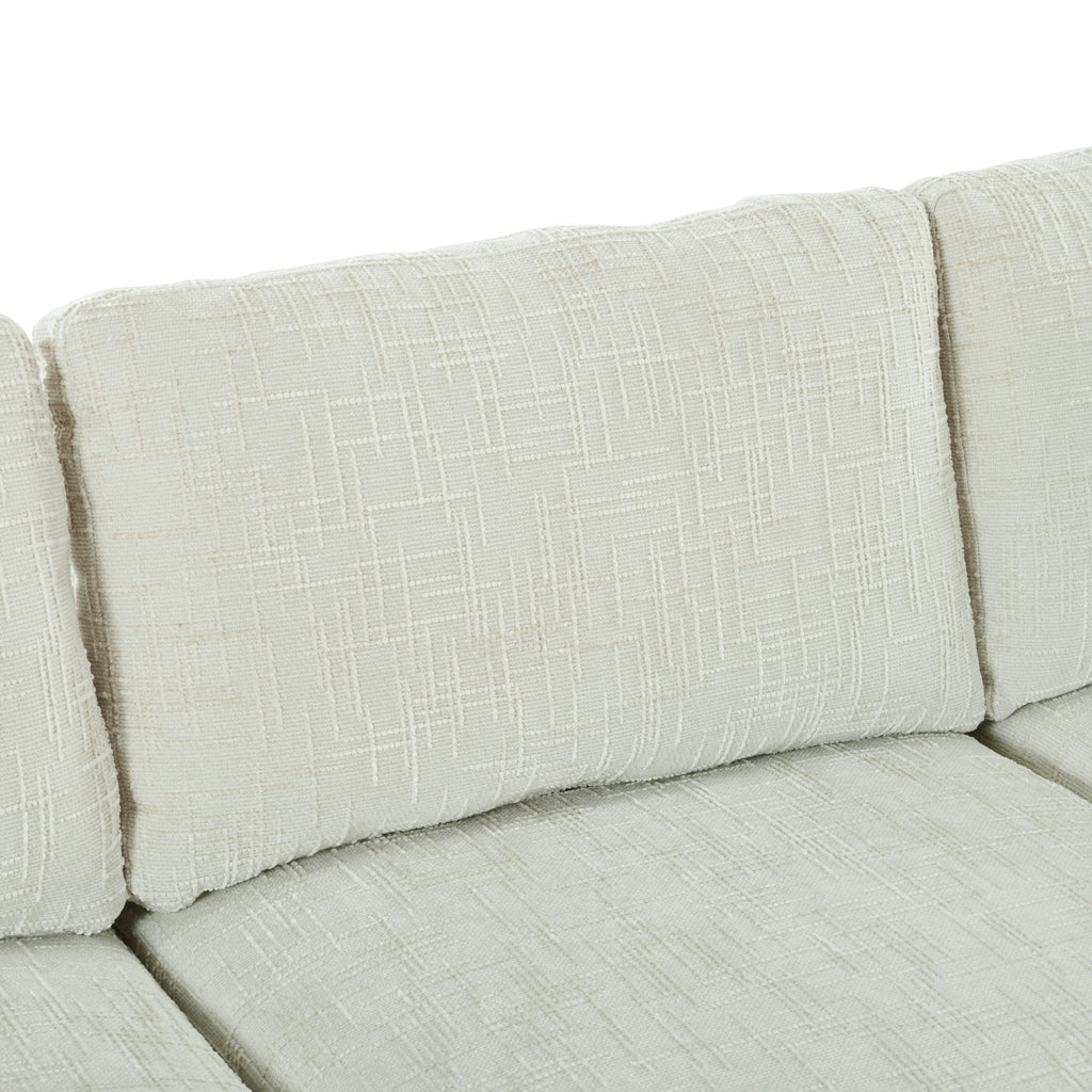 Backrest cushions of the U-shaped sectional sofa with ottoman, emphasizing plush comfort and modular design.