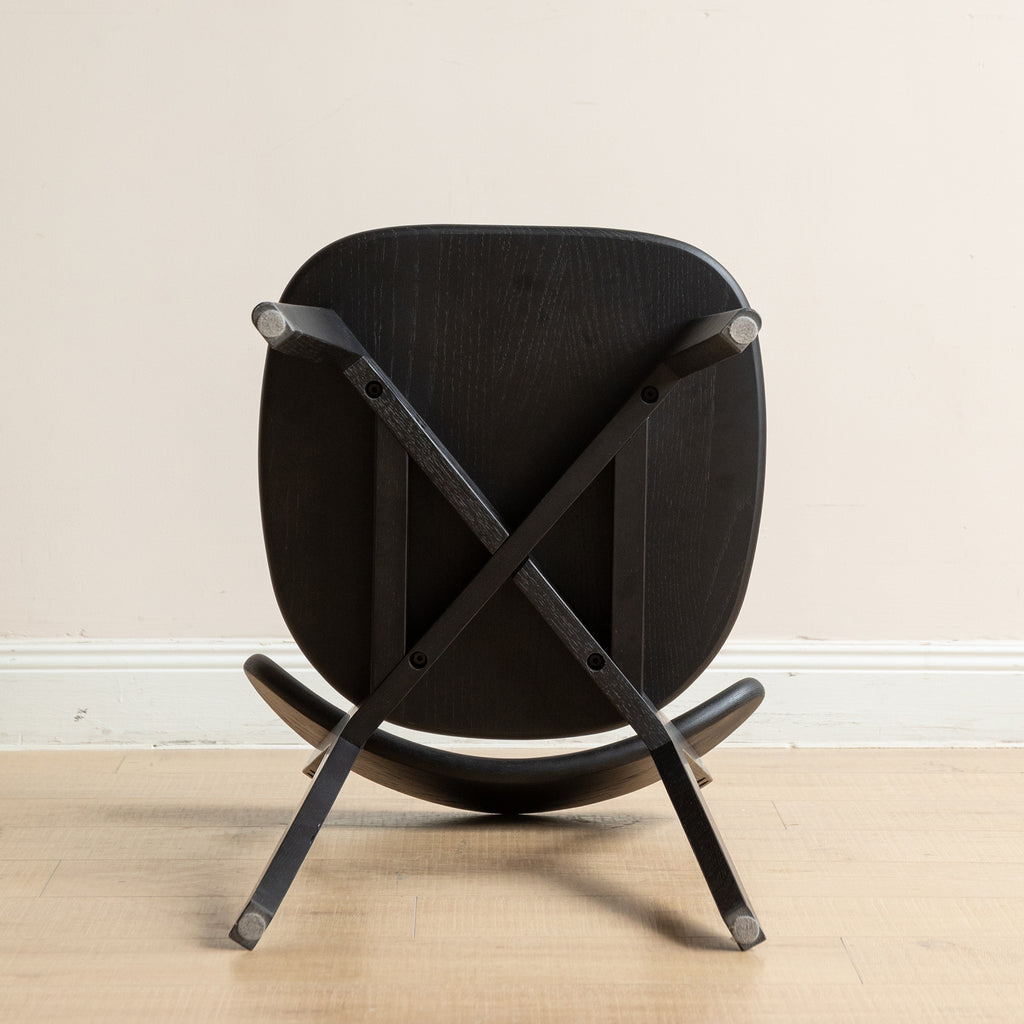 Underside of Solid Oak Dining Chair showing cross-braced leg structure for enhanced durability and support.