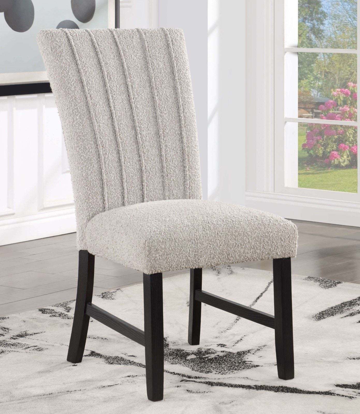 Single gray boucle dining chair with wood legs and tufted backrest from the Genuine Marble Dining Table Set.